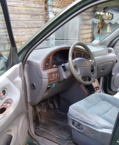 Kia Carnival I, 7 мест, 1999 г.
