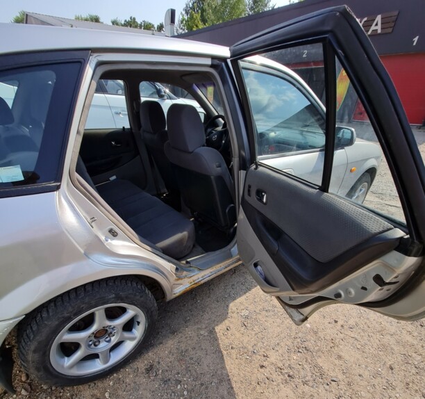 Mazda 323 BJ · Рестайлинг, 2000 г.