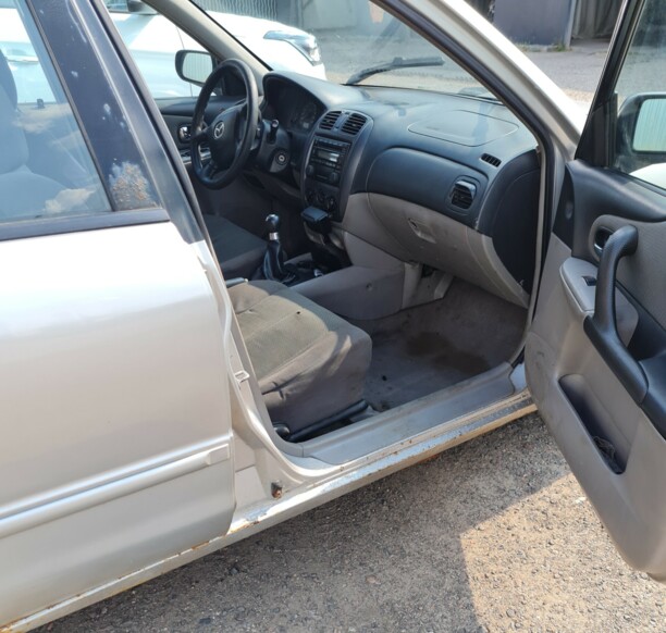 Mazda 323 BJ · Рестайлинг, 2000 г.