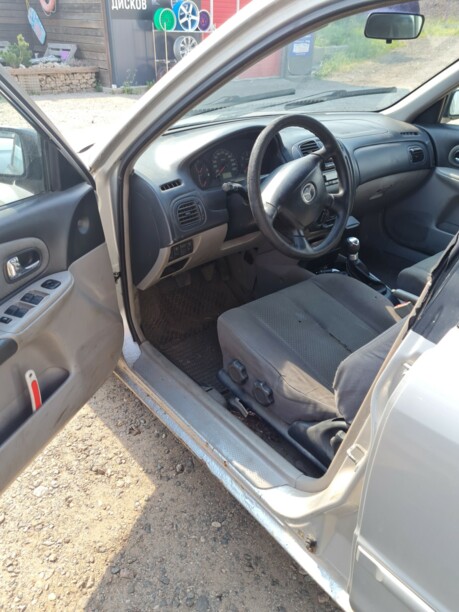 Mazda 323 BJ · Рестайлинг, 2000 г.